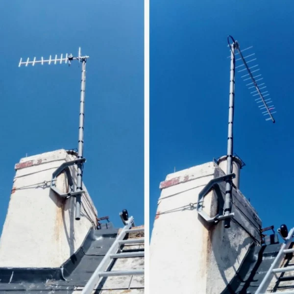 Close-up of a TV aerial installed on a rooftop chimney, showing two different types of aerials against a clear blue sky.